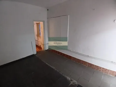 Empty room with tiled floor and a door leading to another room. - image 3