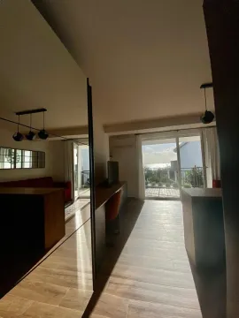 Living room with a sea view and access to the terrace. - image 8