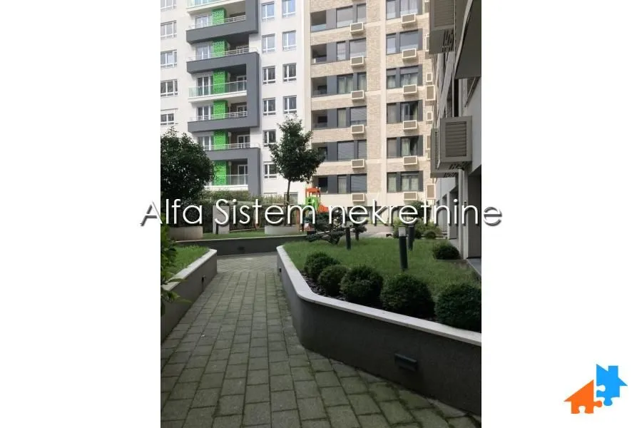 View of the courtyard and facade of a modern residential building.