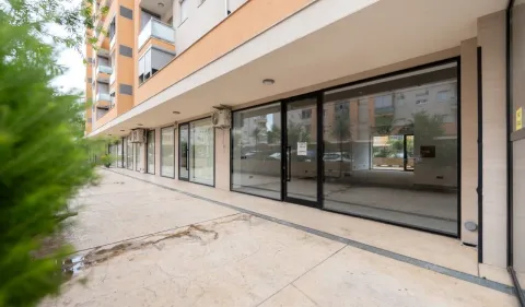 Exterior view of the commercial space on the ground floor of a residential building. - image 5