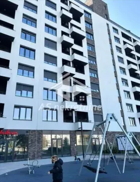 View of the exterior of the residential building with a playground in the yard. - image 25