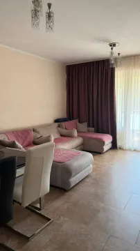 Living room with a sofa set and a dining table. - image 6