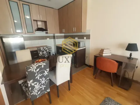 Modern kitchen with dining area and a desk. - image 2