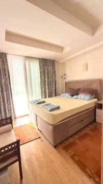 Furnished bedroom with a double bed and access to the terrace. - image 13