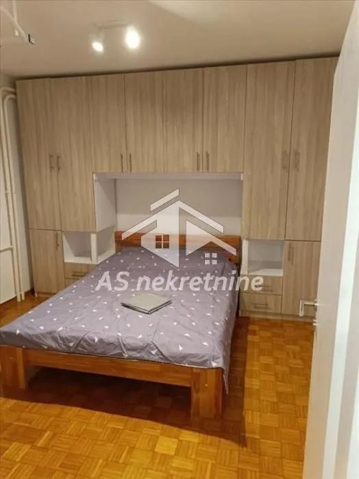 Bedroom with a double bed and fitted wardrobes.