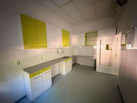 Kitchen with white and yellow cabinetry and a countertop. - image 6