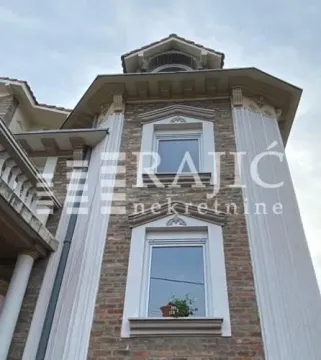 Exterior of a luxury house with stone facade and pillars. - image 9