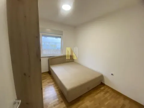 Smaller bedroom with a double bed and hardwood flooring. - image 10