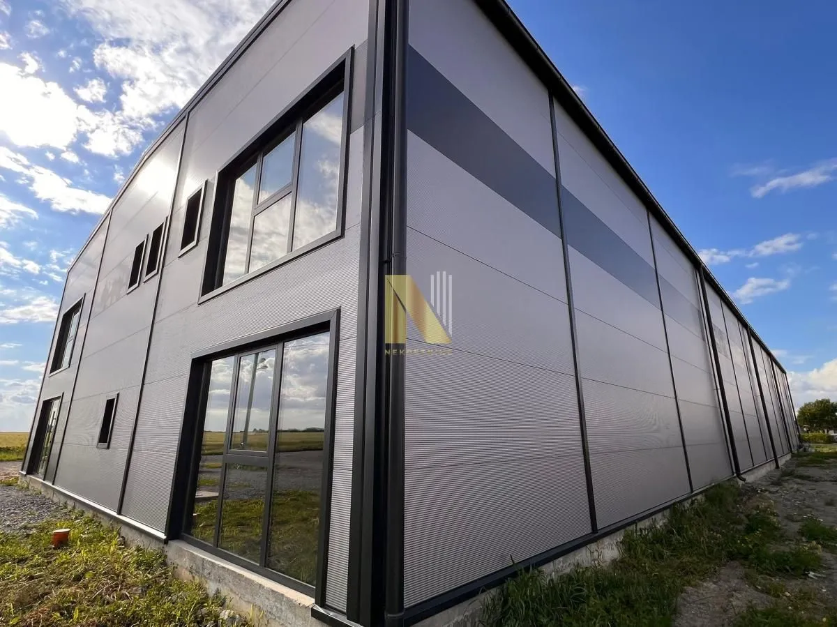 Exterior view of a modern commercial building with large windows.