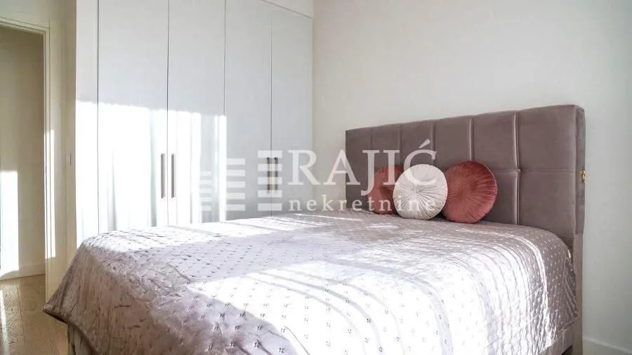 Bedroom with a double bed and a built-in wardrobe.
