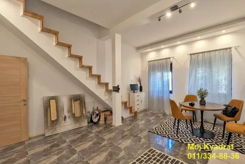 Living room with a dining table, internal stairs, and marble floor. - image 16