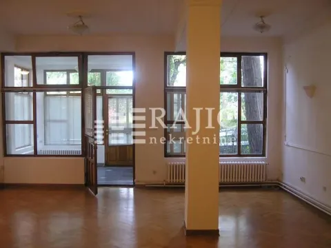 Empty living room with parquet flooring and large windows. - image 6