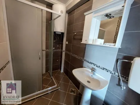 Bathroom with a shower cabin, washbasin, and mirror. - image 22