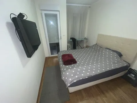 A bedroom with a double bed. - image 9