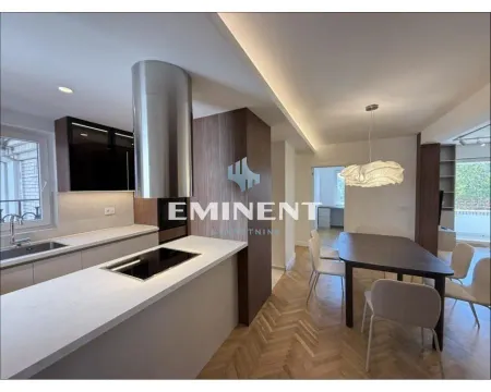 Modern kitchen connected to the dining area and living room. - image 5