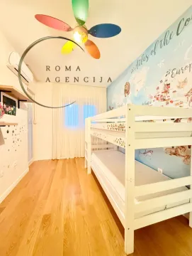 Children's bedroom with a bunk bed and wooden flooring. - image 6