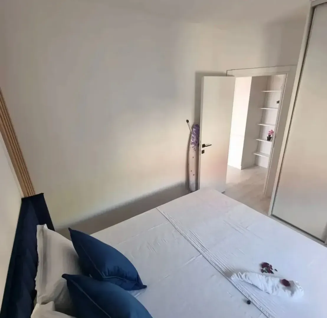 High-angle view of a furnished bedroom with a double bed.