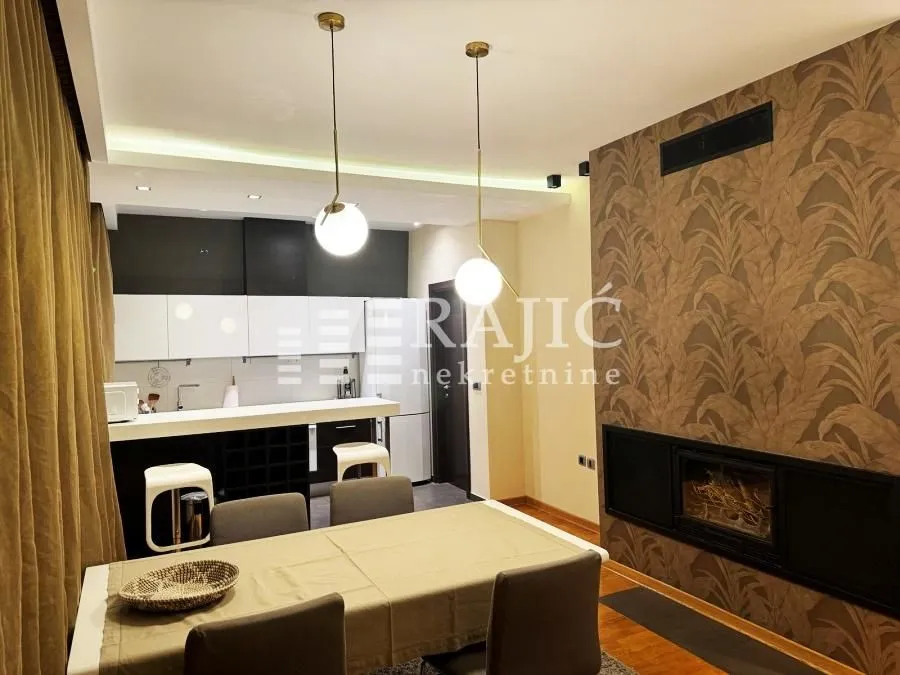 Living room with dining area and fireplace.
