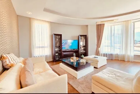 Spacious and bright living room with seating furniture and TV unit. - image 2