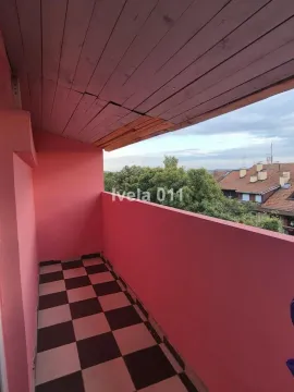 Covered balcony with tiled flooring and a view of the surroundings. - image 4