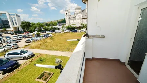 View from the balcony overlooking the surroundings and a temple in the distance. - image 5