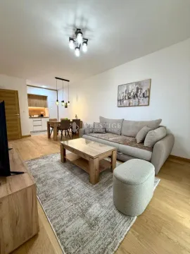 Spacious living room connected to the dining area and kitchen. - image 3