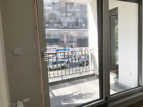 View of the city street from the terrace through glass balcony doors. - image 10