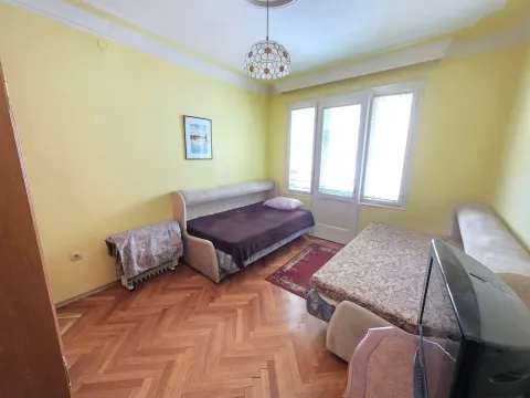 Furnished bedroom with beds and parquet flooring. - image 11