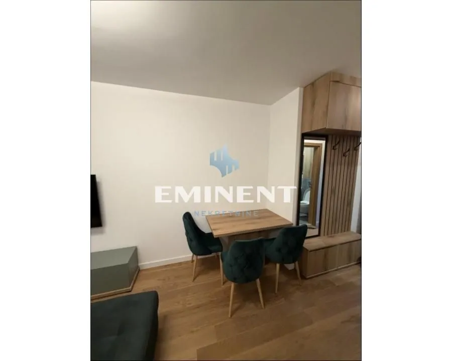 Living room with a dining table and chairs.