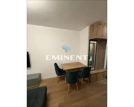 Living room with a dining table and chairs. - image 9