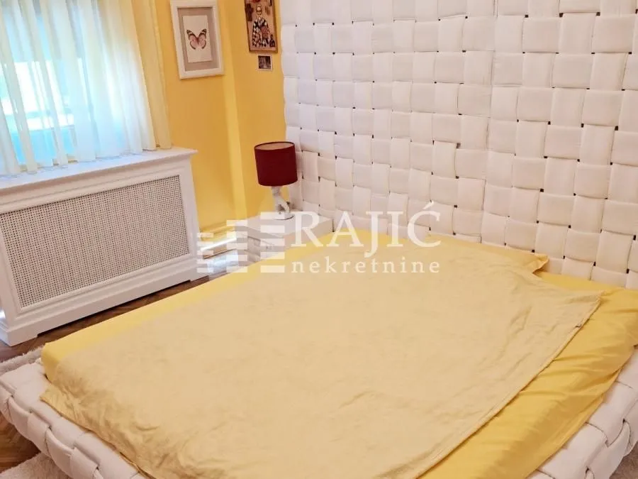 Furnished bedroom with a large double bed.