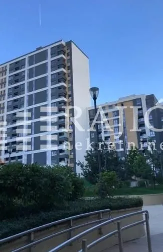 Exterior view of a residential building with a landscaped yard.