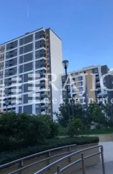 Exterior view of a residential building with a landscaped yard. - image 12