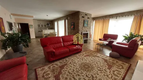 Spacious living room with a fireplace and furniture. - image 3