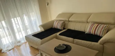 Bright living room featuring a leather sectional sofa and a coffee table. - image 10
