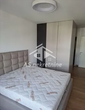 Bedroom with a double bed and a wardrobe. - image 11