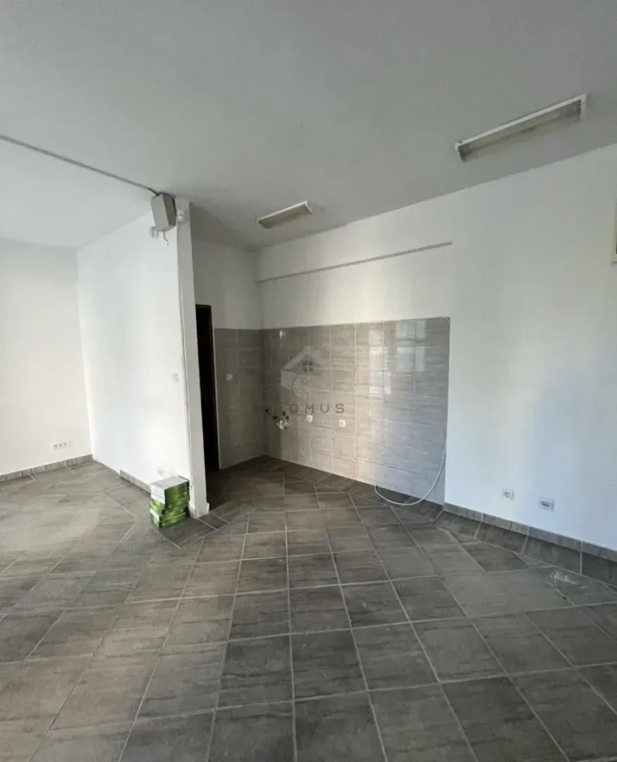 Empty space with wall tiles designated for kitchen installation.