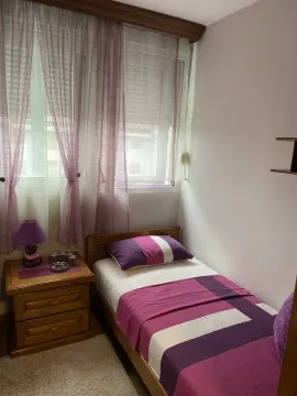 Single bedroom featuring purple details. - image 22