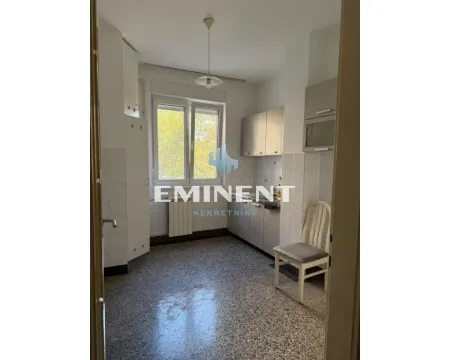 Empty kitchen with white cabinetry and a window. - image 7