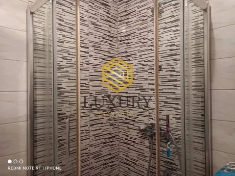 Modern shower cabin with black and white ceramic tiles in the bathroom. - image 3