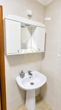 Smaller bathroom with a sink and a mirror cabinet. - image 10