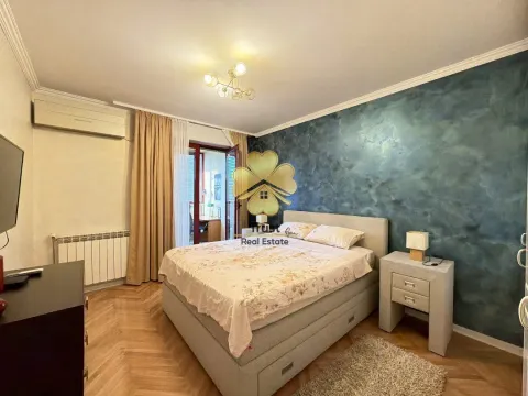 Furnished bedroom with a double bed, decorative wall, and access to the terrace. - image 12