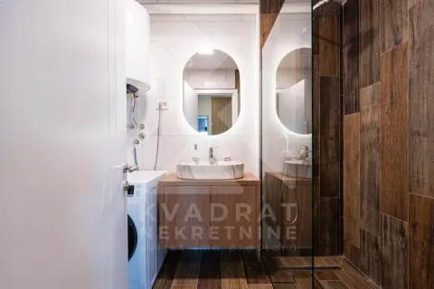 Modern bathroom with a washbasin, mirror and shower enclosure. - image 14