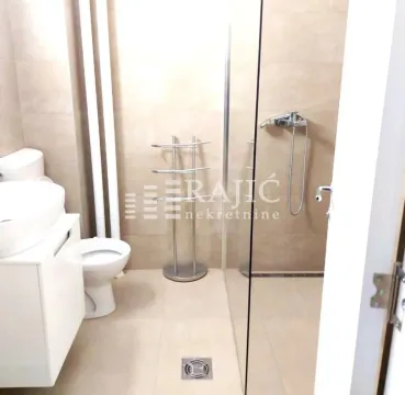 Modern bathroom with walk-in shower and sanitary ware. - image 9