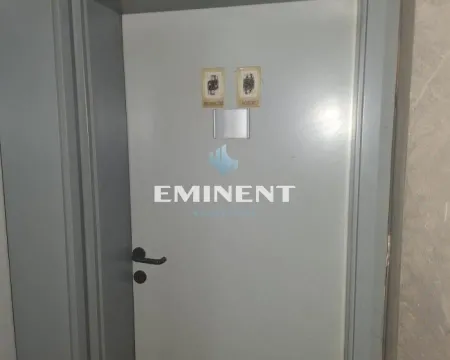 Door with restroom signs in a commercial space. - image 14