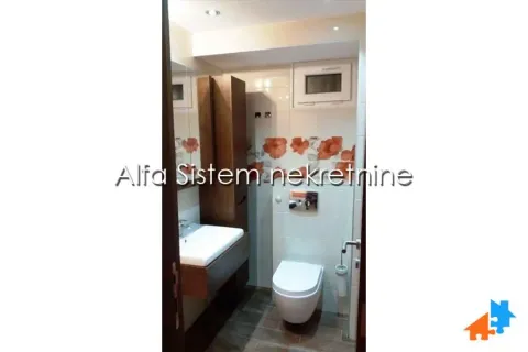 View of the bathroom with a washbasin and toilet. - image 15