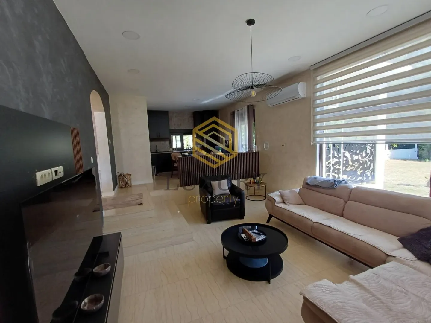 Spacious living room connected to the dining area and kitchen.