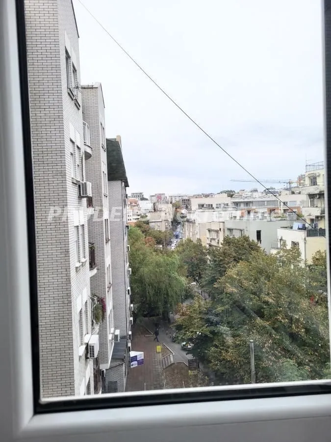View through the window of surrounding buildings and urban neighborhood.