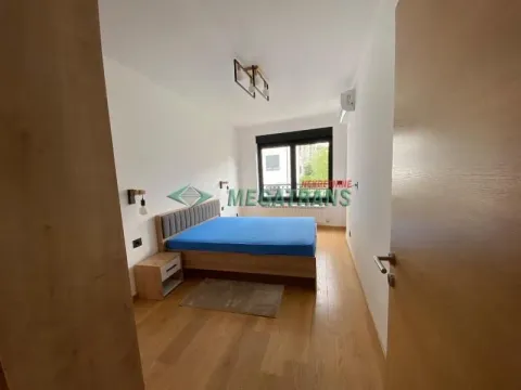 Furnished bedroom with a double bed and a nightstand. - image 18