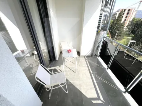 Modern balcony with seating furniture and a view of the surroundings. - image 11